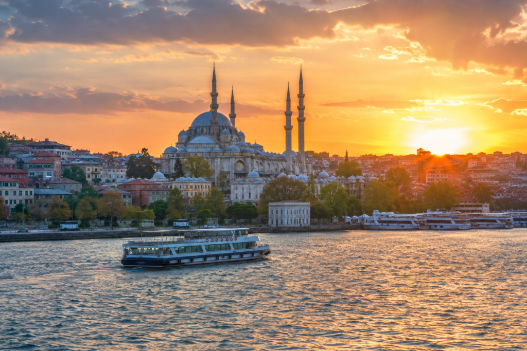 Istanbul mosque and Bosphorus waterfront at sunset